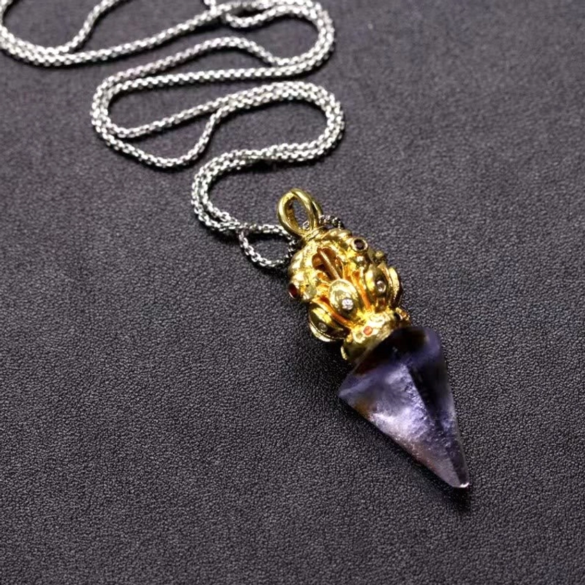 Buddhist Dorje Vajra necklace detail - intricate vajra design with liuli crystal and titanium steel chain