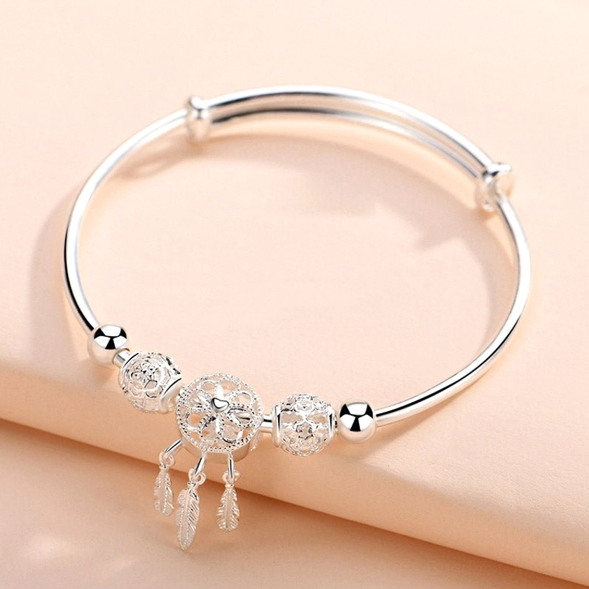 White copper electroplated silver dream catcher buddhist protection bracelet material swatch showing craftsmanship and polished finish