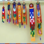 Buddhist Eight Auspicious Symbols embroidered hanging tapestries set with colorful silk tassels on display