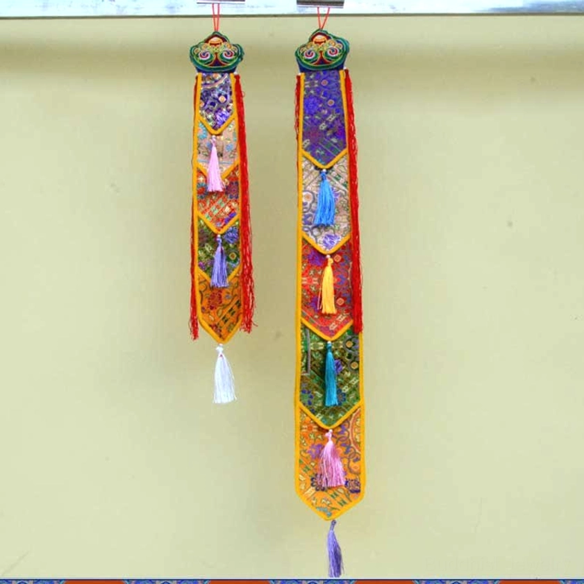 Buddhist enlightenment tapestry with layered embroidered symbols and protective amulet design