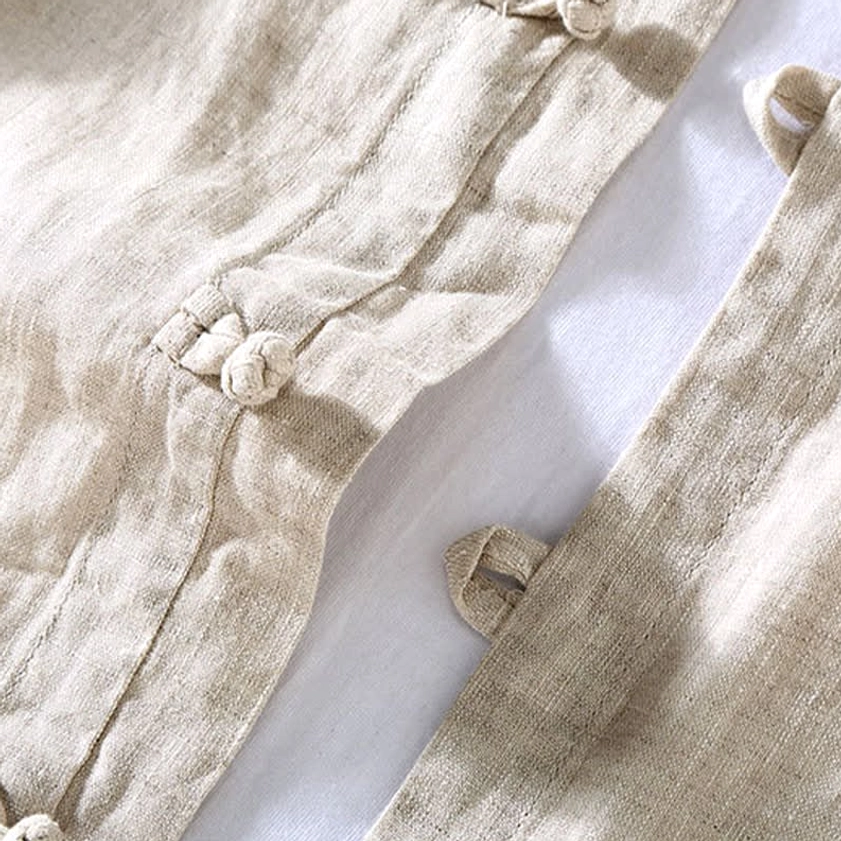 Detailed view of authentic hand-crafted frog button closure on Buddhist meditation clothing