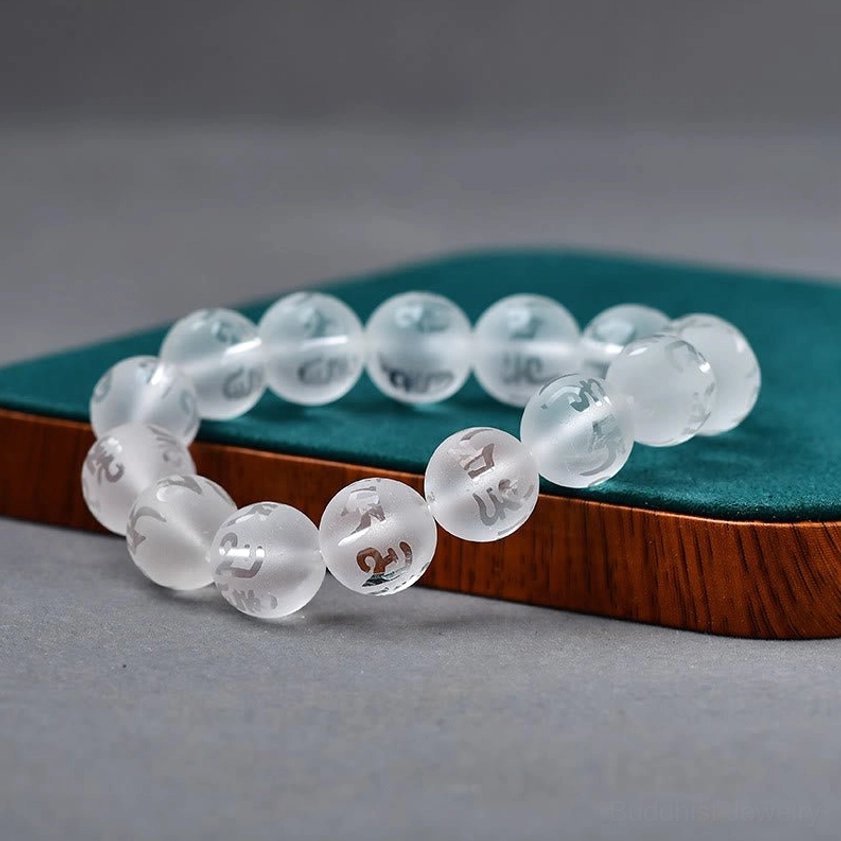 Buddhist gemstone bracelet collection featuring white crystal healing and black onyx protection variations with sacred mantra engravings