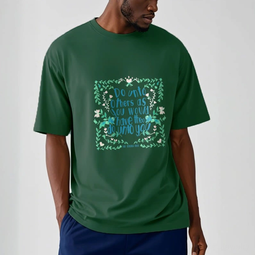 Person wearing light cyan Buddhist compassion graphic tee with golden rule spiritual print front view