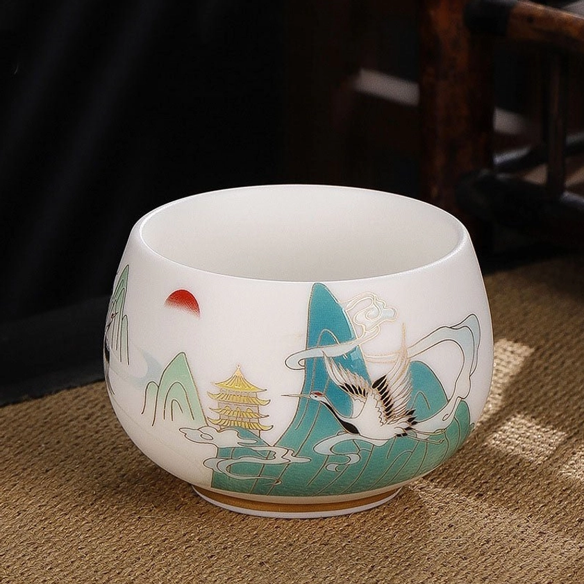 Auspicious crane with clouds ceramic tea cup embodying wisdom, longevity, and elevated consciousness