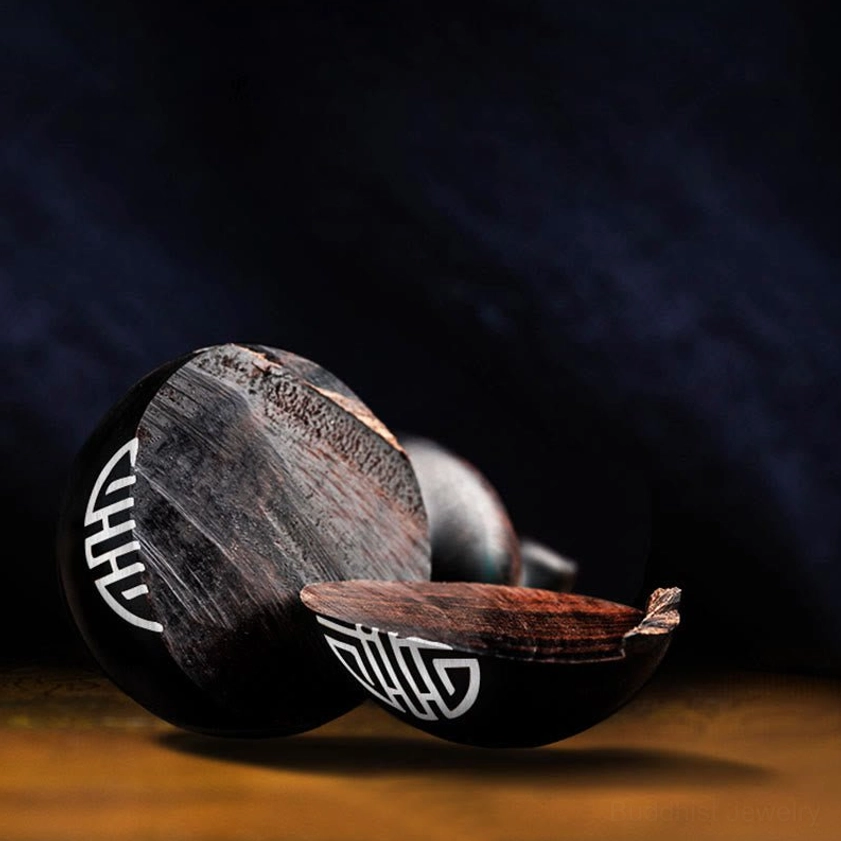 Buddhist gourd keychain detail view showcasing hand-carved protection symbols and natural matte wood surface finish