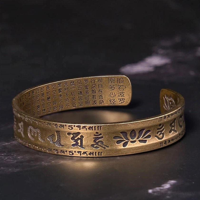 Buddhist heart sutra cuff bracelet displaying outer Sanskrit mantra and inner sutra engravings
