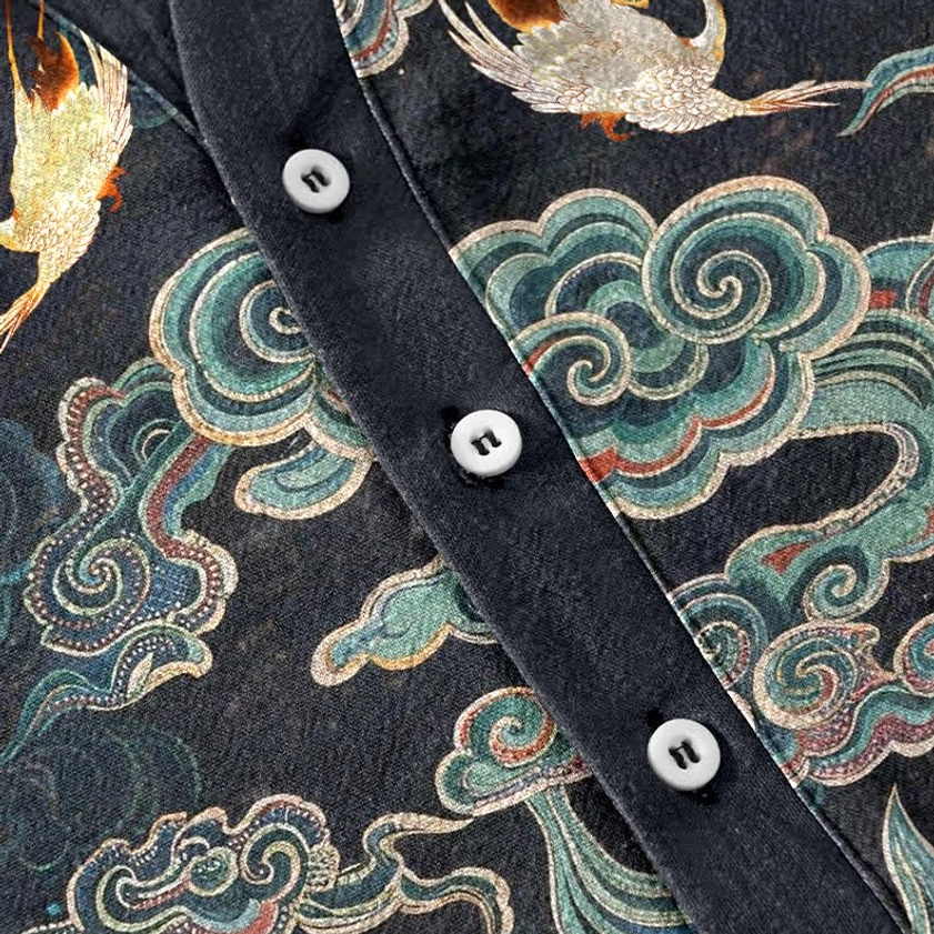 Close-up of white buttons and cloud crane print texture on Buddhist cotton henley