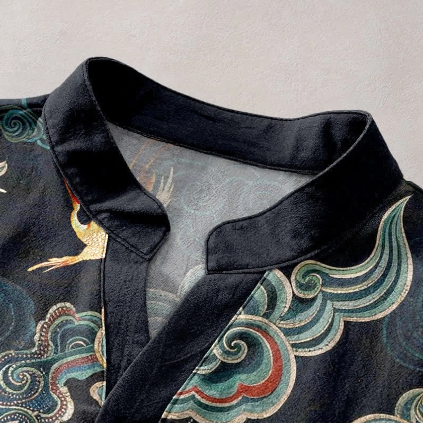 Close-up of stand collar and half button placket on black Buddhist henley shirt