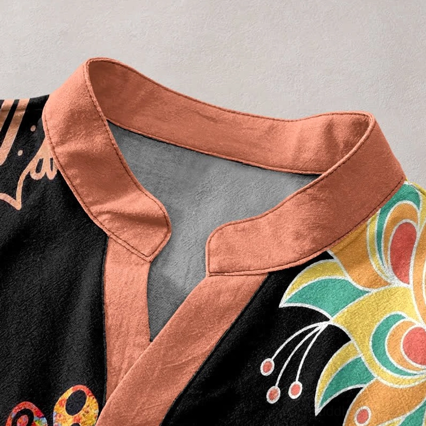 Close-up Detail of Buddhist Henley Shirt Collar and Mandala Print Orange Accent Cotton Fabric