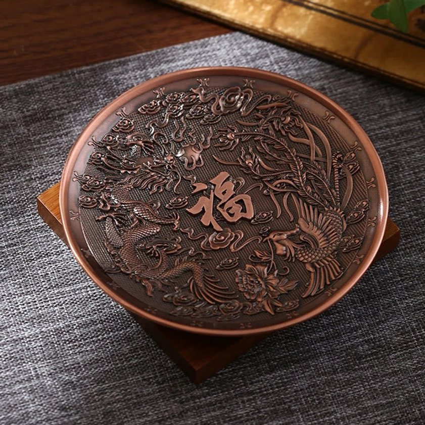 Dragon phoenix Buddhist incense holder in brown bronze tone with carved details, tabletop display