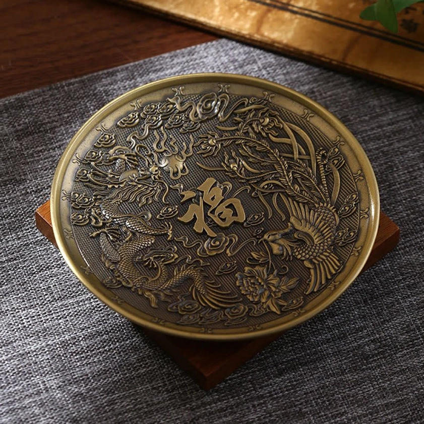 Eight auspicious symbols Buddhist incense holder in bronze finish, overhead view with detailed carving