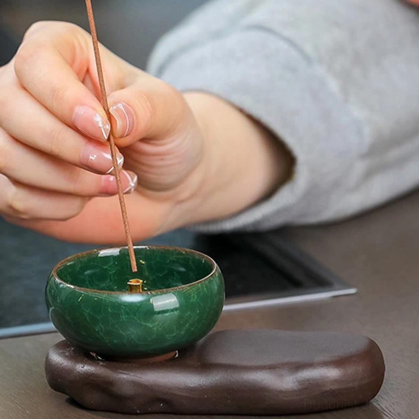 Handcrafted ceramic incense burner with lady figurine showing detailed craftsmanship and natural glaze finish for meditation room decor