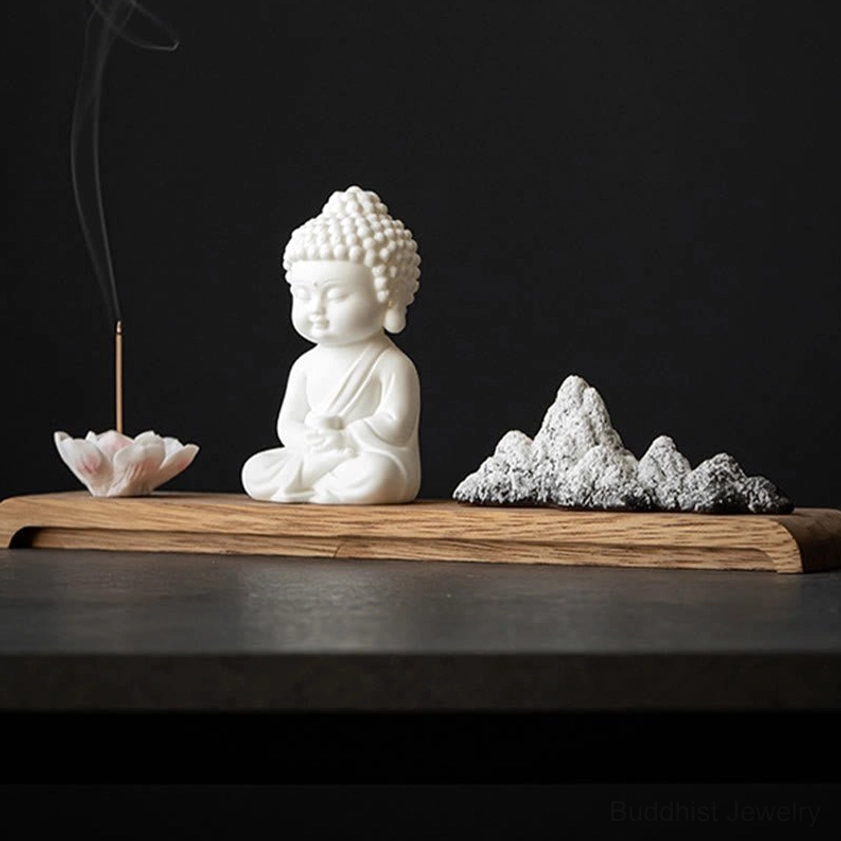 Buddhist incense burner set with lit incense stick and aromatic smoke on dark minimalist table