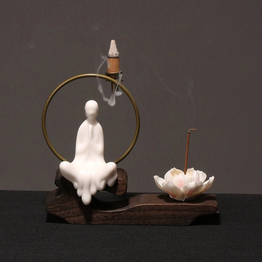 Cross-legged monk incense burner with tower incense cone and cascading smoke, Buddhist meditation decoration with lotus censer