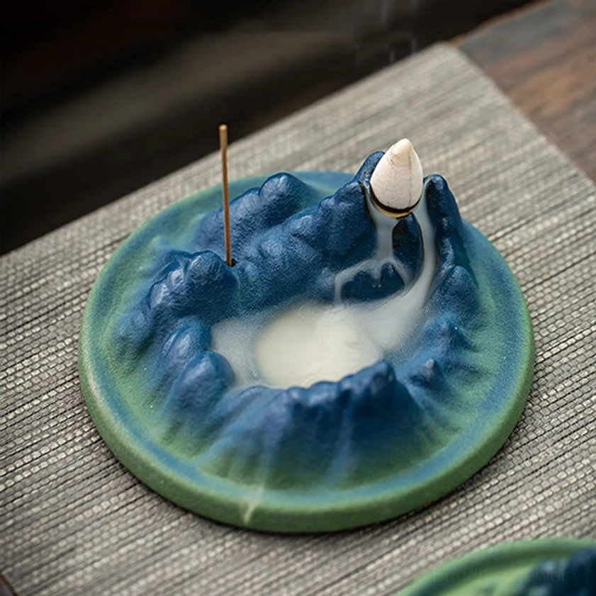Buddhist ceramic incense holder with mountains and river design in meditation setting, ideal for spiritual practice and mindfulness