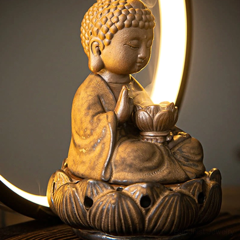 Buddhist ceramic backflow incense burner with LED light in meditation room setting for yoga and spiritual practice
