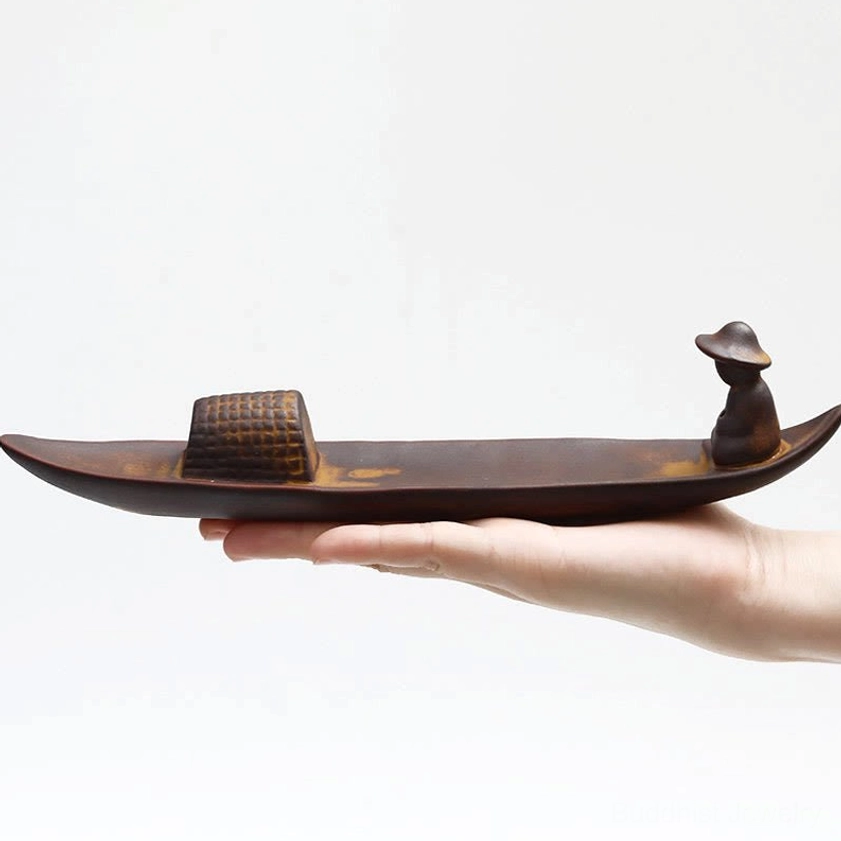 Ceramic incense holder in Buddhist meditation room setting creating tranquil atmosphere