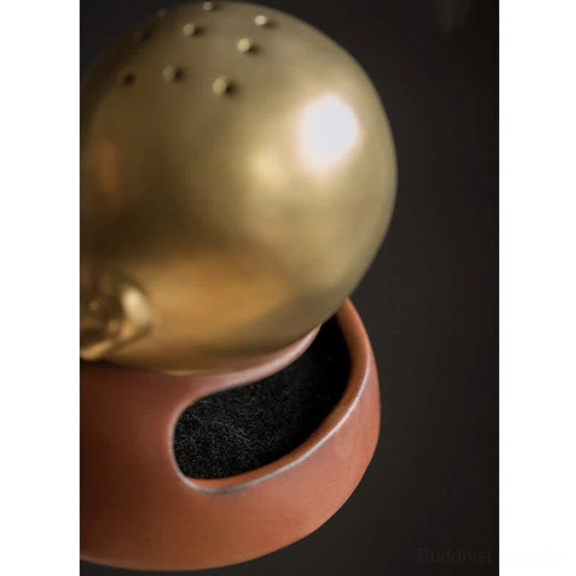 Buddhist incense burner size comparison showing proportions on surface for scale reference