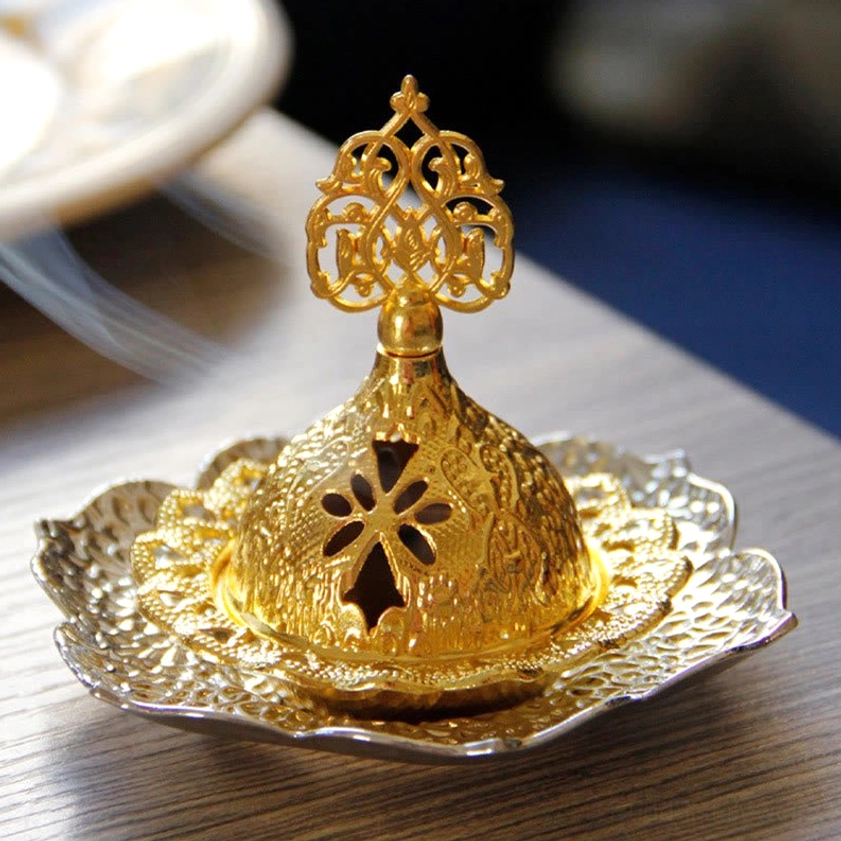 Buddhist incense burner showing intricate metal craftsmanship and spiritual lotus leaf symbolism