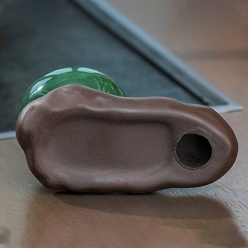 Incense burner base underside close-up showing mounting hole and separated green ceramic bowl for easy cleaning and assembly