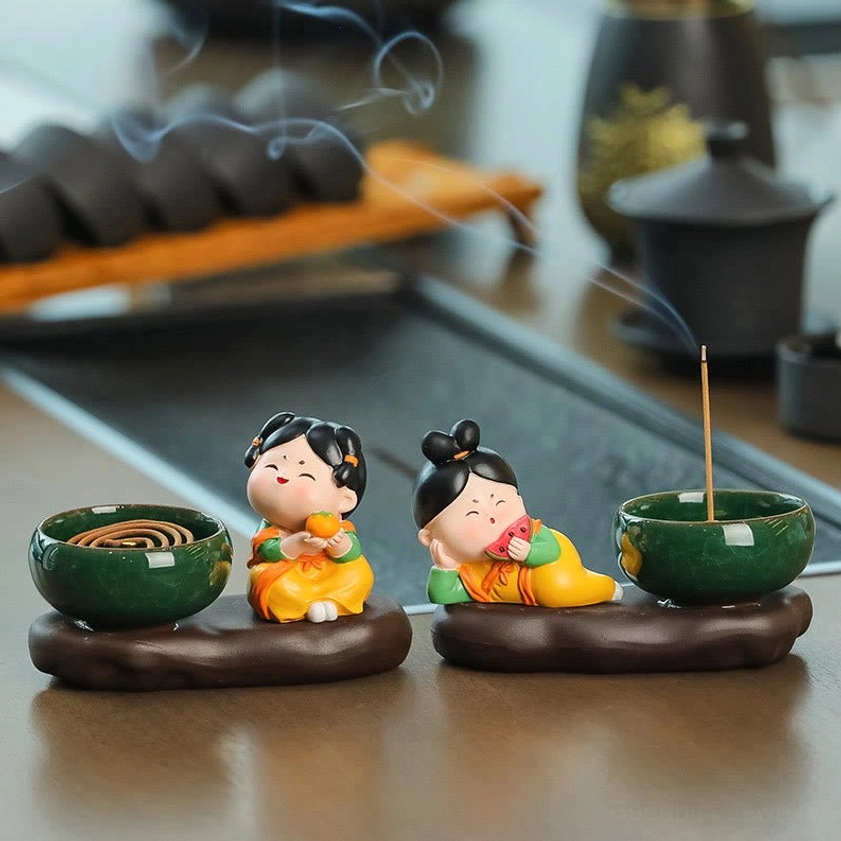 Ceramic incense burner showing complete assembly of lady figurine with motif, ceramic bowl, and sculptural base for incense burning