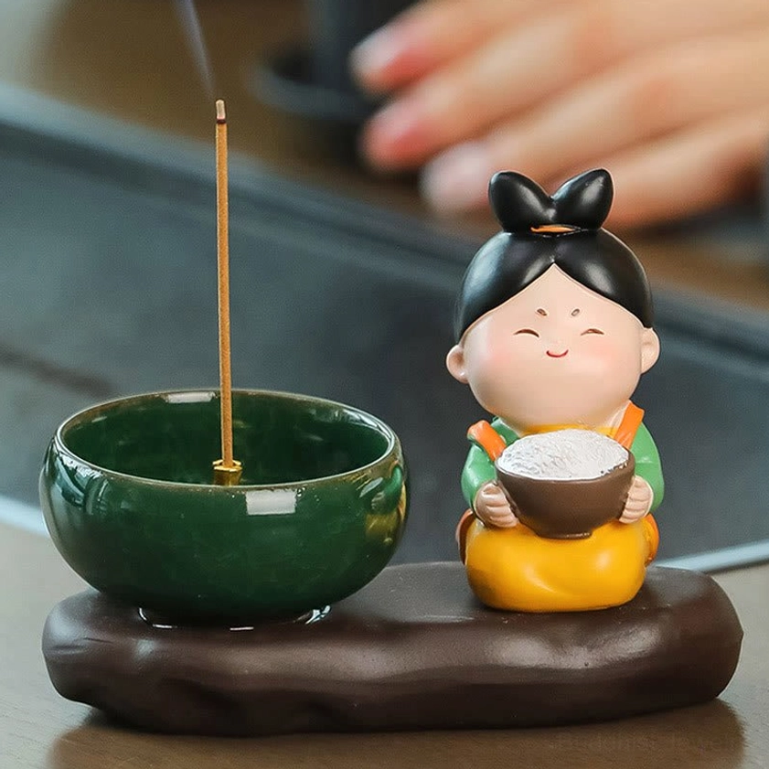 Buddhist ceramic incense burner with rice motif style lady figurine, showing glazed ceramic bowl and sculptural base design