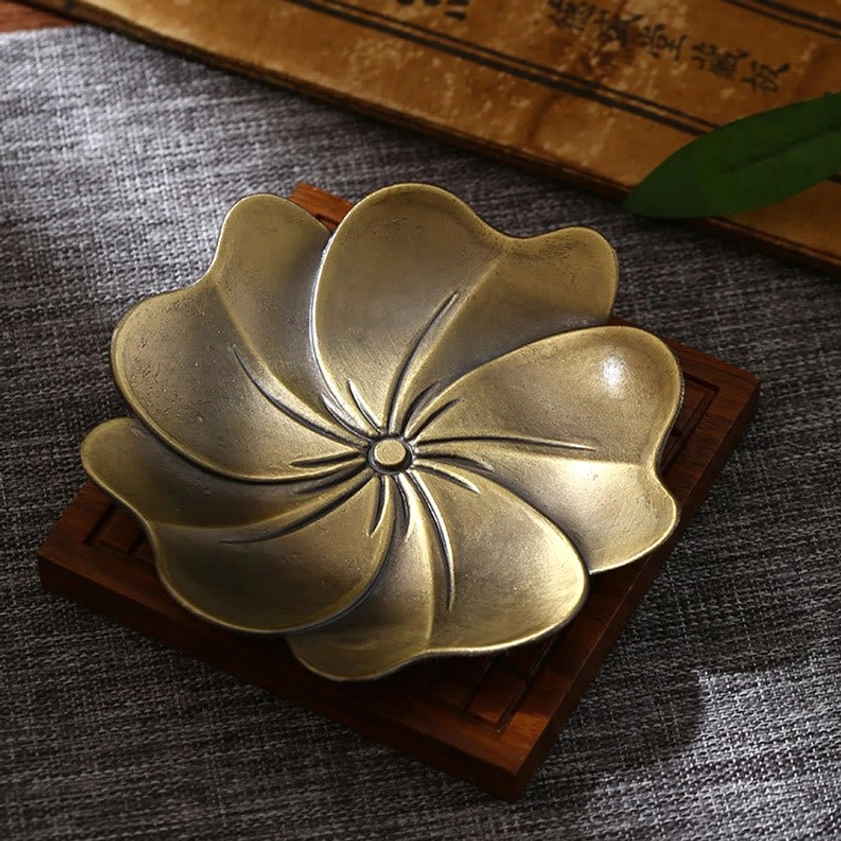 Lotus design Buddhist incense holder in bronze finish, overhead tabletop display with embossed patterns