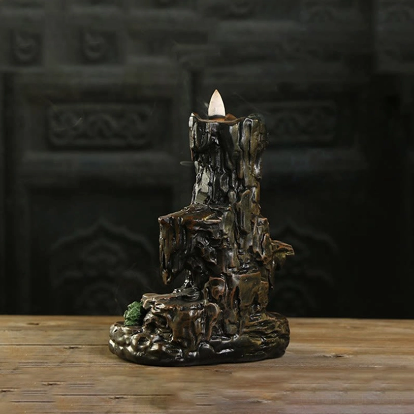 Buddhist mountain backflow incense burner unlit display, weathered dark brown resin with moss decoration, side angle view