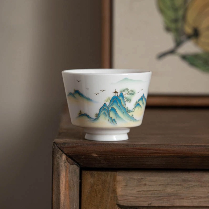 Buddhist porcelain tea cup with traditional hand-painted artwork symbolizing inner peace and spiritual awakening