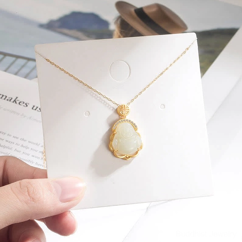 Laughing Buddha jade necklace pendant on retail jewelry display card with thin sterling silver chain, eye-level product presentation