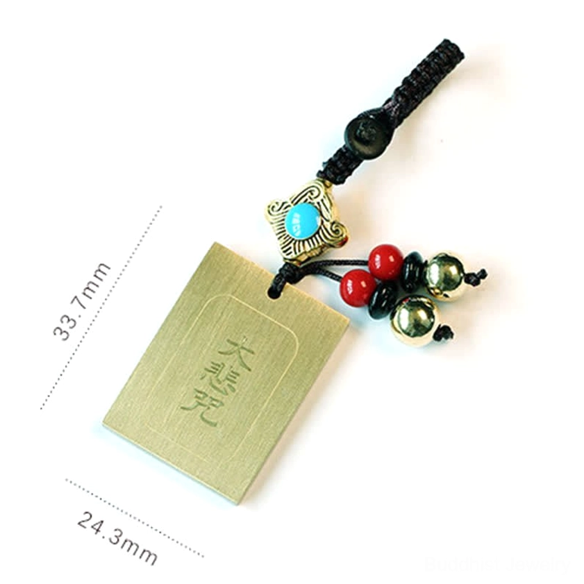 Buddhist sacred mantra keychains collection - variety of brass charms featuring Bagua, prayer wheel, and protective mantras