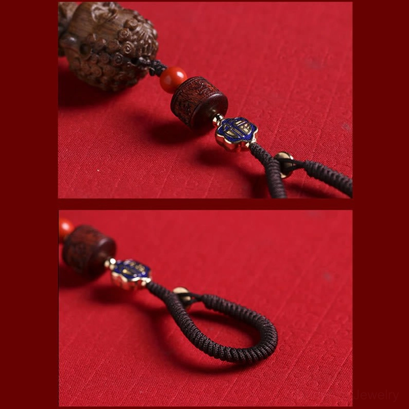 Buddhist keychain component details showing woven cord enamel charm cinnabar beads and sandalwood Buddha head separately