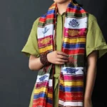Multicolored Buddhist Khata scarf featuring endless knot and golden lotus embroidery with vibrant striped design, displayed front view