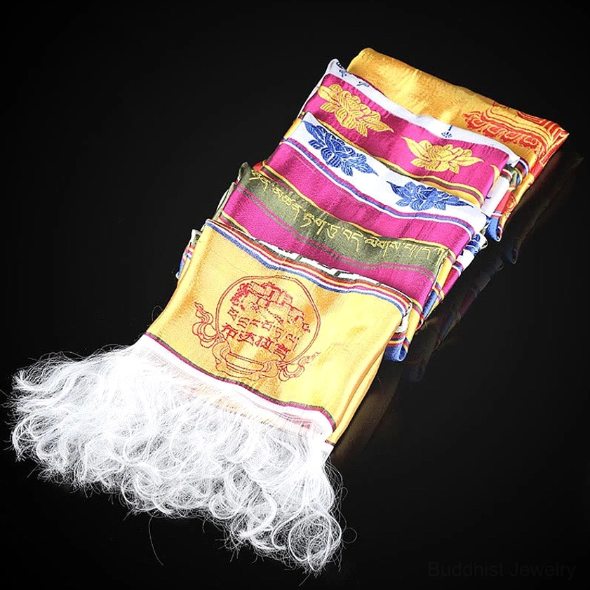 Stacked Buddhist Khata scarves with fluffy white tassels and embroidered sacred lotus and endless knot motifs