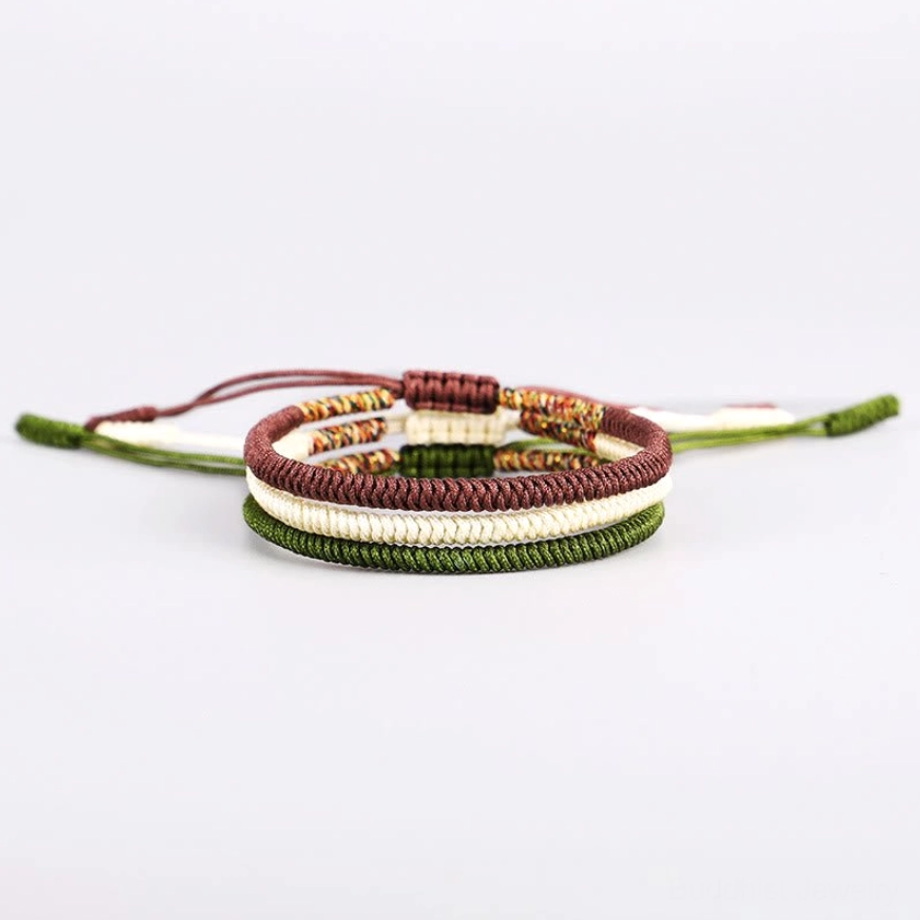 Buddhist King Kong Knot bracelet with handwoven braided cord, featuring adjustable closure and spiritual protection symbol
