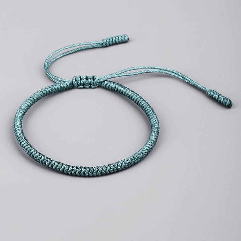 Light cyan blue Buddhist King Kong knot bracelet - single braided band with adjustable pull cord for protection