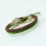 Handcrafted Buddhist King Kong Knot bracelet set featuring brown, white, and dark green braided cords with decorative spiritual knots for luck and protection