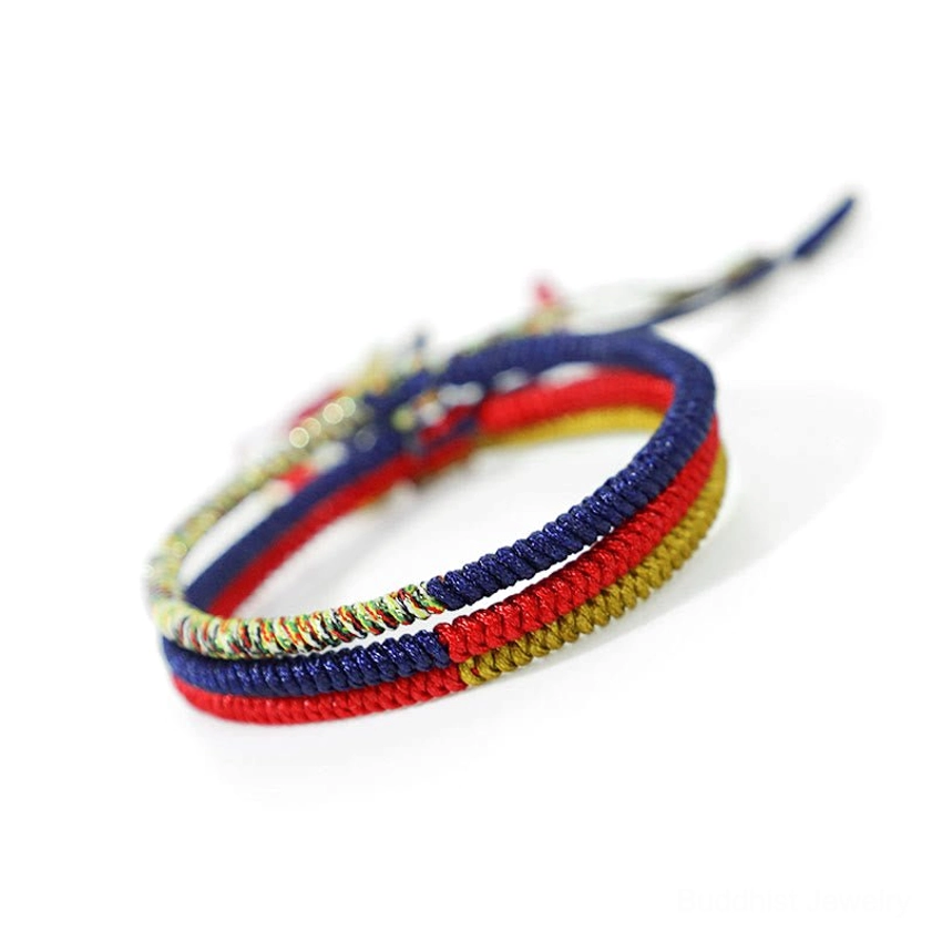 Handmade multicolor King Kong knot braided protection bracelet with red string and loose cord ends
