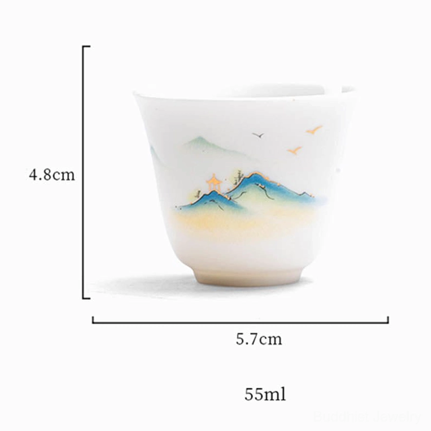 Hand-painted Buddhist ceramic tea cup with traditional Eastern landscape and nature motifs for tea ceremony and Zen practice