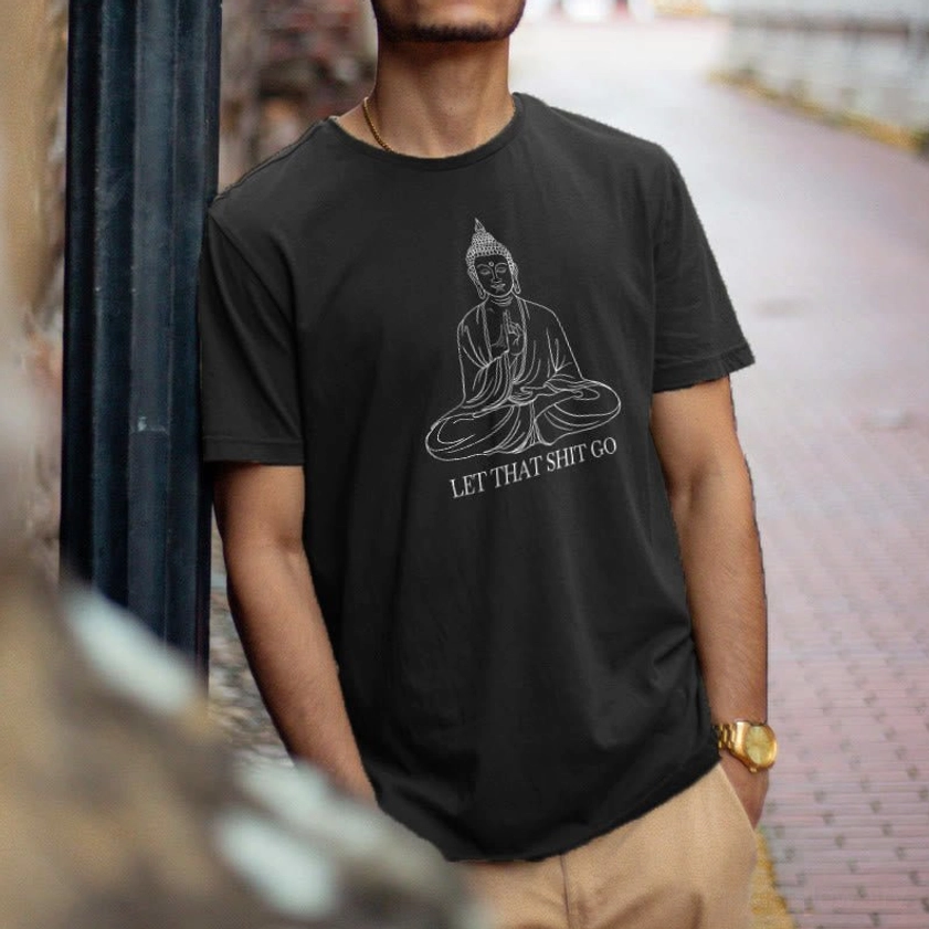 Man wearing black let that shit go Buddha tee streetwear outdoor styling