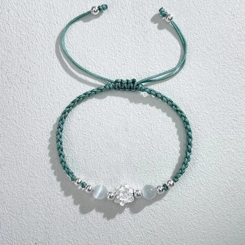 Buddhist spiritual string bracelet with lotus charm green cord and protection bead styling