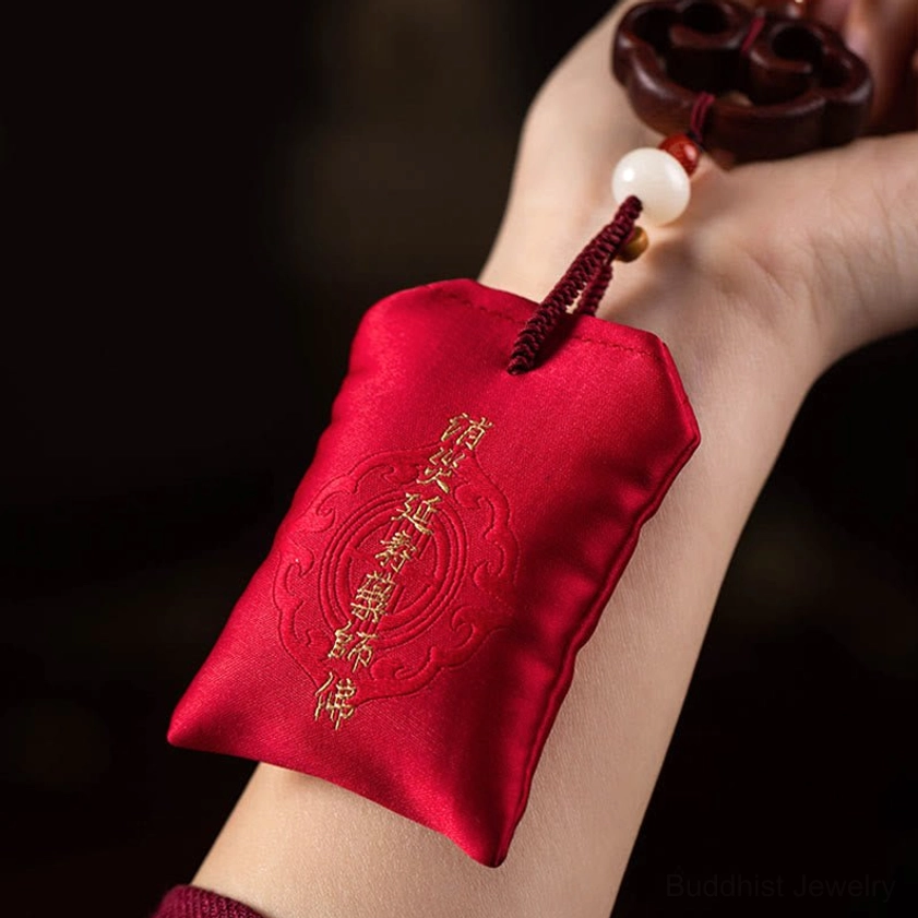 Artistic display of Buddhist lotus car hanging sachet with embroidered blessing, sandalwood beads, and traditional spiritual ornaments