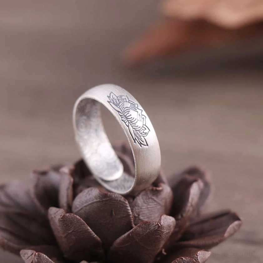 Handcrafted silver lotus ring with delicate engraving and matte silver finish, side view showcasing open band design