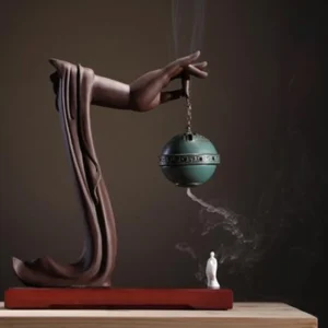 Buddhist lotus hand incense burner green ceramic with zen figurine and incense smoke
