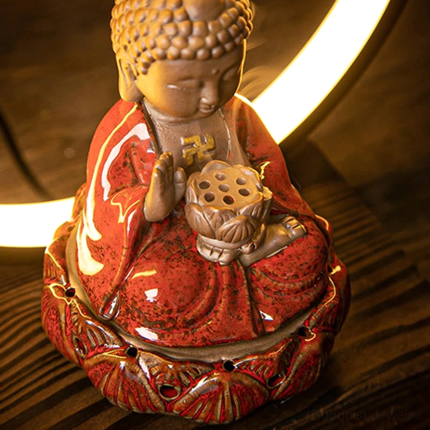 Oblique angle of Buddhist backflow incense burner showing lotus-shaped base with flowing backflow smoke and circular LED light