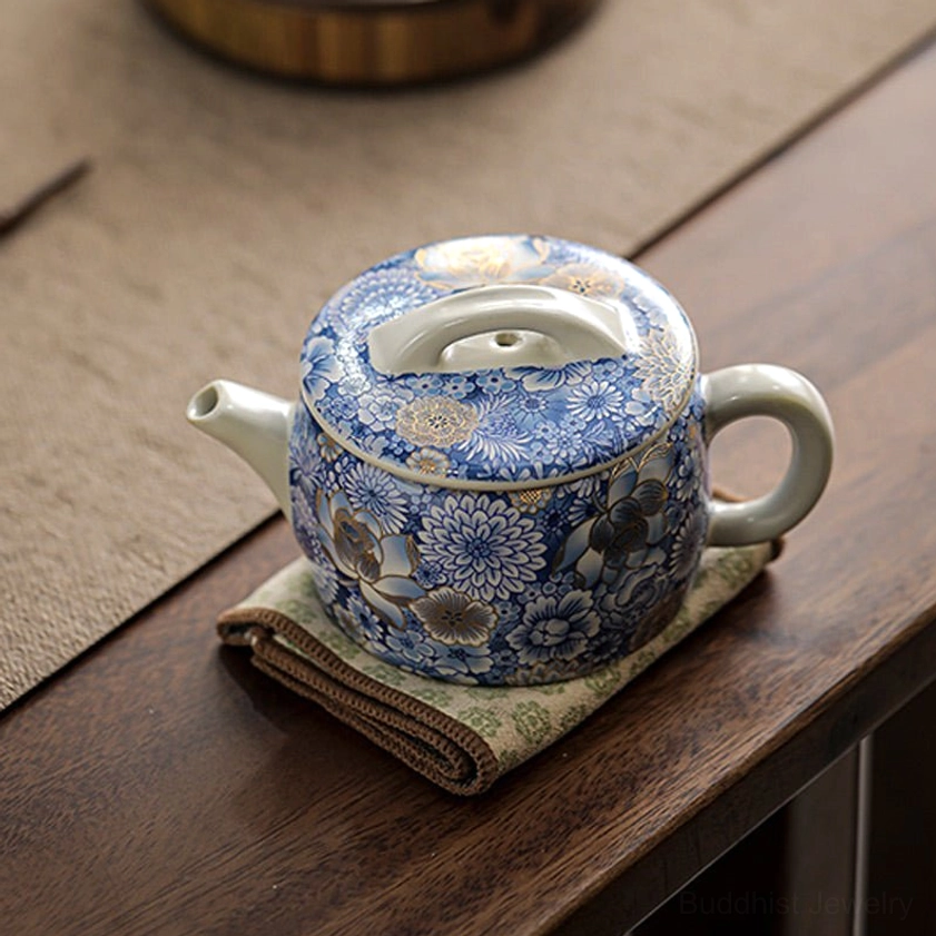 Handcrafted porcelain teacup featuring Buddhist lotus symbolism for meditation