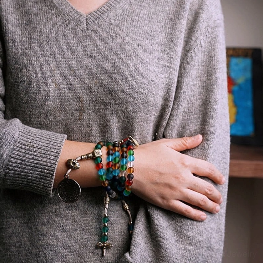 Buddhist mala bracelet with Nine Palaces Bagua charm, protective spiritual symbol in metal with glass bead accents
