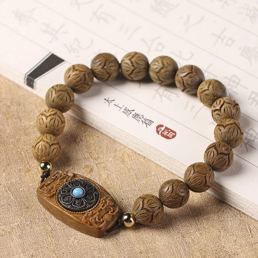 Buddhist mala bracelet on vintage Chinese calligraphy paper, handcrafted sandalwood beads