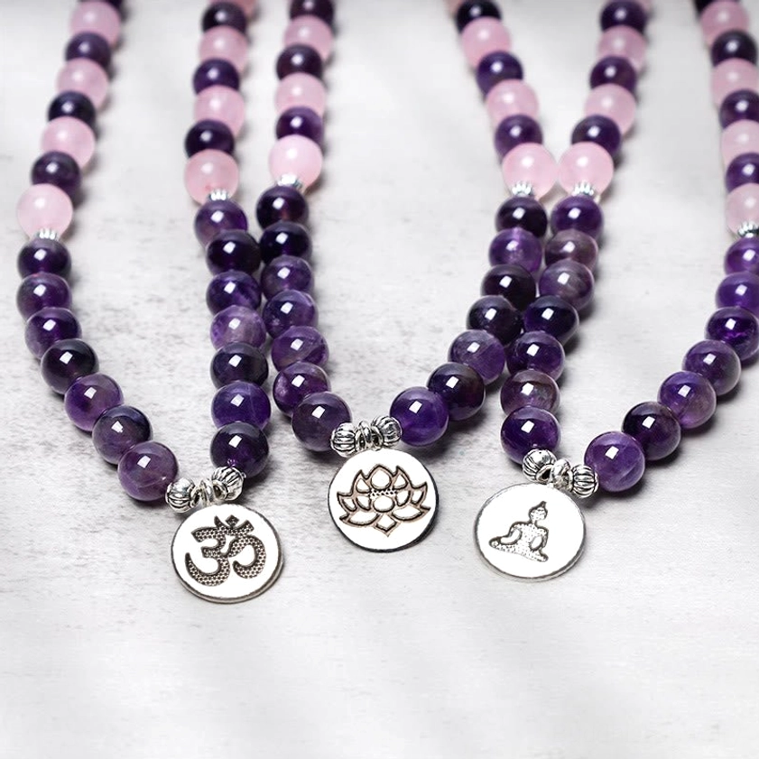 Buddhist mala bracelets collection featuring rose quartz, amethyst and lotus pendant designs