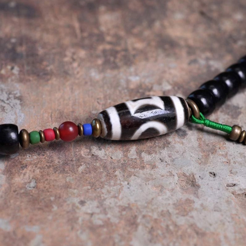 Buddhist 108 bead mala bracelet with ebony wood and hand-painted dzi bead quality shot